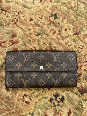 Louis Vuitton Monogram Sara wallet in Brown and Tan with blue floral interior